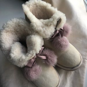 UGG powder pink women’s boots with poms. Size 6/7